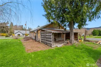 Additional covered storage/wood shed off the garage