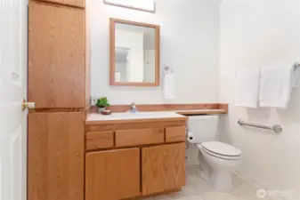 Guest bath in hall near laundry.