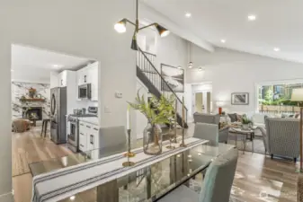 Main living spaces feature vaulted ceilings and abundant windows, creating a bright, open, and airy atmosphere throughout the home.