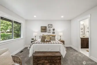 Luxuriously remodeled 3/4 ensuite bathroom off the primary bedroom.