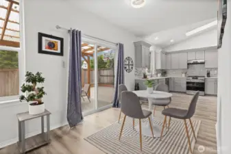 Breakfast nook leads to the new covered pergola outdoor living space.