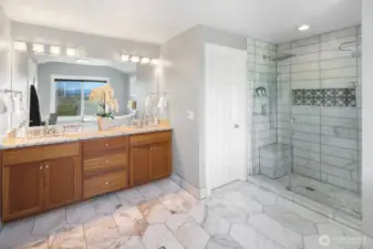 His and Hers vanity and top of the line bidet/commode.