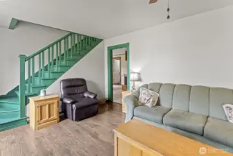 Spacious living area featuring hardwood floors.
