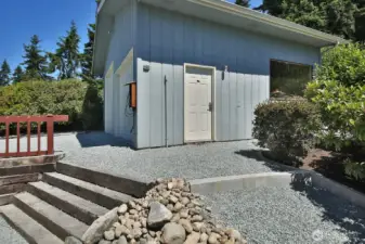 You have stepped outside the Primary/Guest Suite. Plenty of height if you want to make this into indoor RV parking. Or keep it in its shop form.
