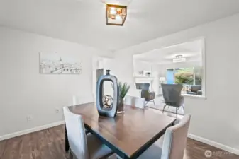 Another view of the dining space highlights its connection to the main living room, making it easy to host meals while remaining part of the conversation.