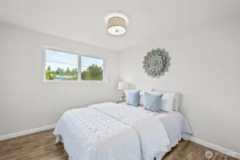 The third bedroom features a spacious feel with wide windows and an open outlook. This room easily adapts to fit a variety of lifestyle needs.