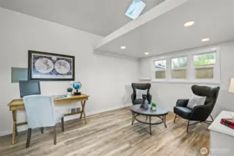 The home includes a versatile detached bonus area, ideal for an office, studio, or media area. With vaulted ceilings, skylight, and bright windows, it offers plenty of usable space for work or relaxation.