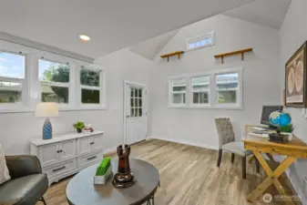 The detached bonus space features vaulted ceilings, multiple windows, and private entry — ideal as a home office, studio, or flex room.