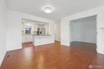 Open to kitchen with Den doors open on the right