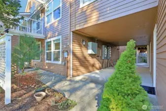 Covered Patio on left with walkway to the garage side door on right