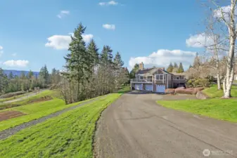 Driveway toward garage door on left