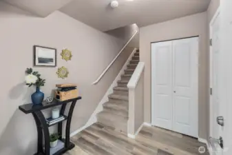 Functional entry landing/coat closet/direct garage access