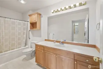 Spacious bath with tub/shower and full sized vanity.