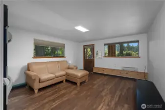 Downstairs living room - gas fireplace to the left of the couch. Door exits to lakeside.