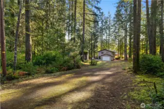 View of the lot from the street side, entering the driveway.