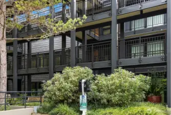 Two EV chargers are located in the parking area of Building 2