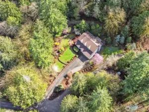 A stunning aerial perspective showcasing the home’s impressive footprint and serene surroundings.