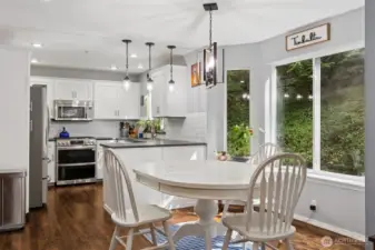 Perfectly centered between the kitchen and living room, the cozy nook is ideal for casual meals or morning coffee.