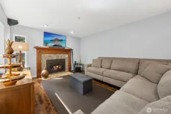 The living room offers a spacious, comfortable retreat with seamless flow to the kitchen and nook.