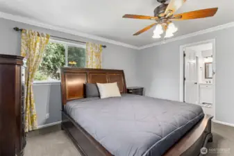 The primary bedroom offers a peaceful escape with a luxurious en-suite bathroom for ultimate comfort and convenience.