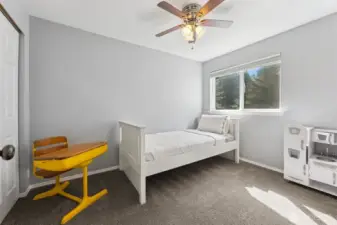 spacious bedroom with plenty of natural light.