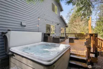 Soak and unwind in the private hot tub while enjoying serene surroundings.
