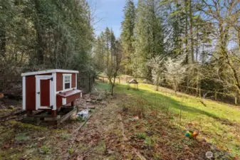 The property’s classic barn adds charm and versatility to the outdoor space.