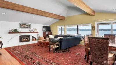 Living room has a cozy wood stove for the chilly months, while the home also has a heat pump with AC for the warm summer season. You won't ever get sick of these views.