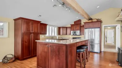 Tall kitchen island with lots of cabinets for storage. All of the kitchen items in this home come with the sale.