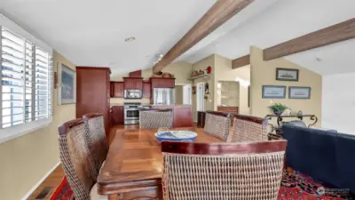 Looking from the dining area back towards the beautiful kitchen. This home is open and inviting.