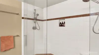 Taking a shower will be heavenly in this custom shower with dual shower heads.