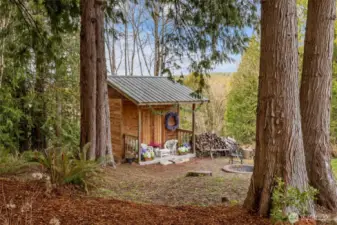 Pathway to a firepit and lounging shed.