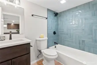 Lower Level Full Bath w/Custom Tile Shower Surround, New Laminate Flooring and New Vanity, Fixtures.