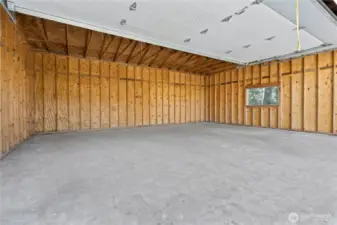 INTERIOR of the Huge 720sqft 3-Car Garage/Shop w/Separate RV Door. Super Clean!