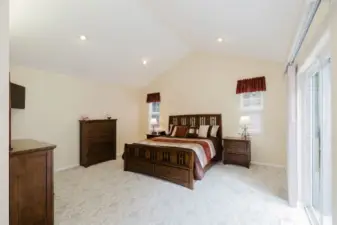 Massive Primary Suite with vaulted ceilings, and plenty of natural light.