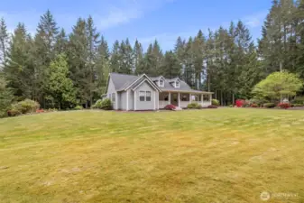 The house sits regally in the center of the property, allowing for natural light in every window and large open space all the way around.  Trees and shrubbery line the perimeter of the property, allowing for maximum privacy.