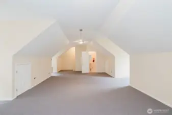 Enormous loft space above garage, includes a half bathroom