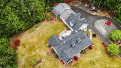 This property is surrounded by a sprinkler system, making yard work easier.