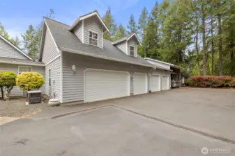 FIVE CAR GARAGE WITH 2 RV/BOAT CARPORTS ATTACHED.  Garage is heated, insulated, and oversized.  You can bring all your toys!!!