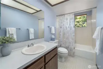 Bathroom has a large vanity and linen closet for all of your products.