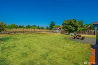 Big level lot is fully fenced. Bonus…watch the hot air balloons take off from the field behind the house.