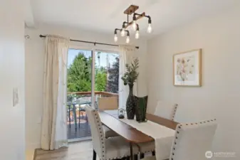 Dining room flows out to the deck and into the kitchen.