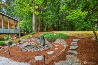 Bubbling fountain provides a lovely focal point in the front yard.