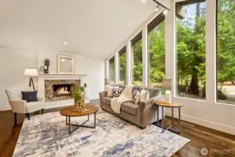 Vaulted ceilings and walls of windows bring in tons of natural light while highlighting the park-like scenery.