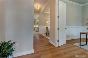 Extended hardwood flooring throughout the main level of this new home provides both a rich appearance and easy cleaning surface