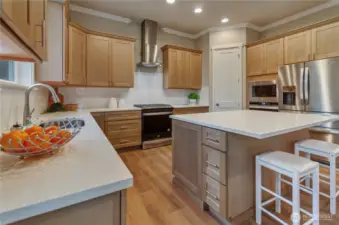 Generous cabinetry makes storage easy while the Whirlpool range, double ovens and refrigeration allow prep and cooking meals and snacks to be easy and without limitation.
