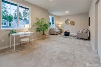 Upstairs is a large bonus area perfect for that home gym, play area or media room.