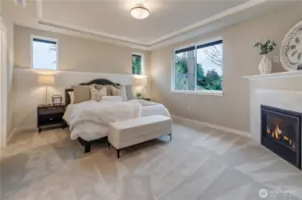 Nothing is more inviting than our primary bedroom with well-positioned windows, durable wall-to wall carpeting, a coved ceiling with painted crown moulding and a custom natural-gas fireplace. So comfortable, you will not want to leave.