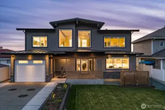 Sleek and rare, this modern custom-built home showcases clean lines and walls of glass, perfectly sited on 60 feet of pristine low-bank saltwater frontage. West-facing design captures the most dramatic Whidbey Island sunsets, blending contemporary luxury with the timeless beauty of waterfront living.