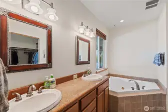 Primary bath with soaking tub and walk in shower.